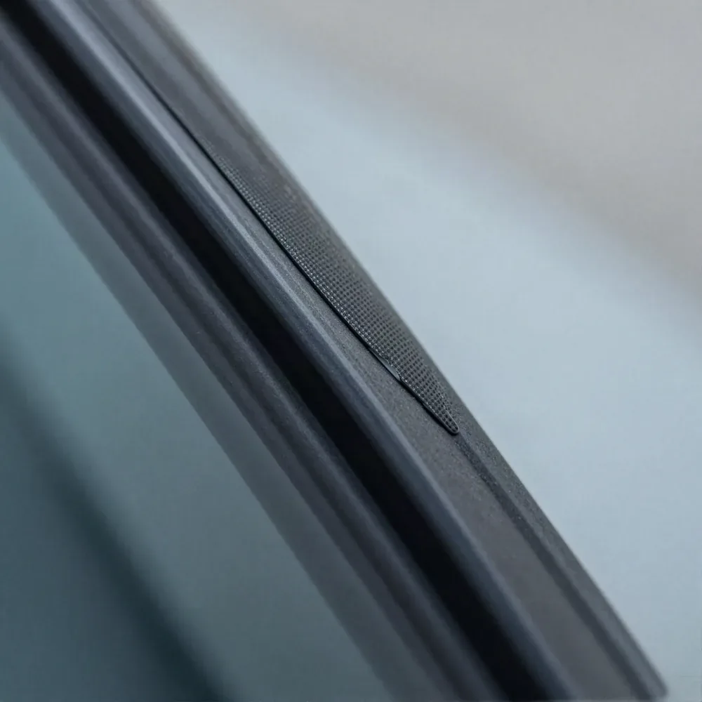 Close-up of a chip in a windshield being repaired